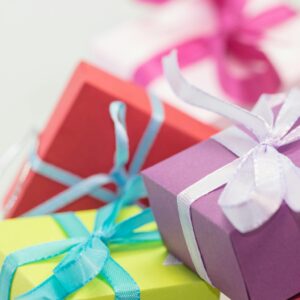 Close-up of vibrant gift boxes with ribbons, perfect for festive occasions.
